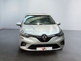 the front view of a white car parked in a showroom