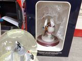a snow globe with a snowman inside of it on a table