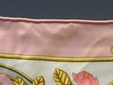 a close up of a pink purse with flowers on it