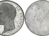 a close up of a coin on a white background