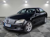 the mercedes c - class is parked on a checkered floor