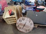 a clock sitting on top of a pallet next to other items