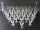 a lot of wine glasses sitting on a table