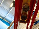 a close up of a traffic light hanging from the ceiling