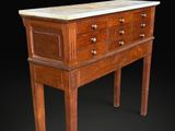 an image of a wooden chest of drawers with marble top
