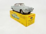 a toy car sitting on top of a yellow box