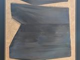 painting of a blue and white abstract painting on a wooden table