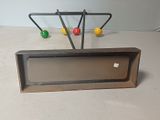 a picture of an old fashioned radio with colorful balls on it