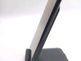 a cell phone that is sitting on top of a stand
