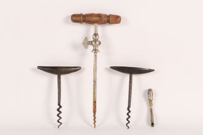 three different types of wine openers on a white surface