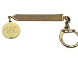a close up of a key chain with a coin on it