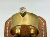 an image of a gold ring with a diamond on top of it