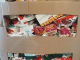 a cardboard box full of food that is sitting on a pallet