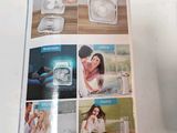 a magazine with a picture of a woman holding a toothbrush
