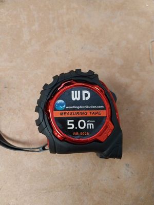 a measuring tape that is laying on the floor