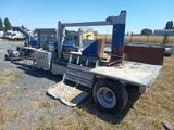 an image of a truck with a crane in the back
