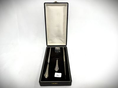 a black box with a silver spoon and a fork in it