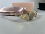 pink velvet case and sunglasses on a table with a pink velvet case