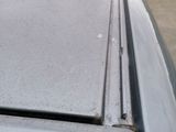 a close up of a car ' s roof with a broken window