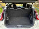 the back of a car with the trunk open and the seats folded down