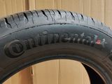 a close up of a tire on a cardboard box with a box in the background