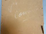 a brown box with writing on it and a pair of scissors next to it
