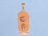 a gold pendant with an egyptian symbol on it