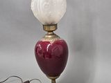 a lamp that is sitting on a table next to a wall