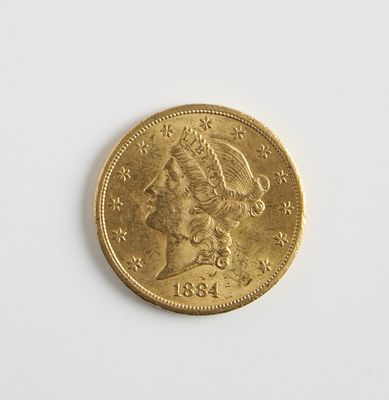 une image d'une pièce d'or sur une surface blanche