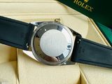 a rolex watch in a box on a table