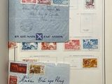 an open book with a bunch of stamps on it and a piece of paper attached to it