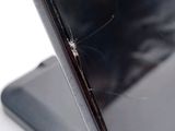 a small spider that is sitting on the back of a laptop