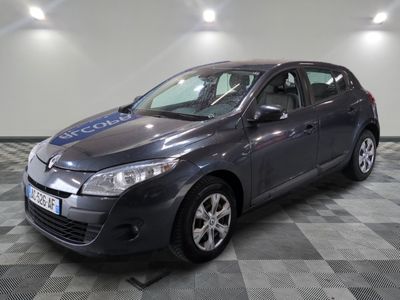 a picture of a grey car parked in a garage
