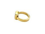a close up of a gold ring on a white background