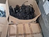 a box full of wires and other electronics on the floor