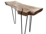 a wooden table with hairpin legs on a white background