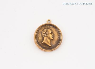 a close up of a gold coin with a woman ' s face on it