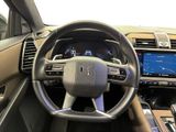 the interior of a car with a steering wheel, dashboard, and dash board