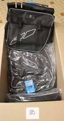 a suitcase and a bag in a box on the floor