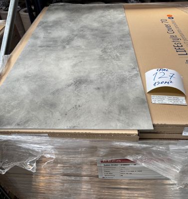 a large box of cardboard sitting on top of a pallet