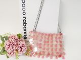 pink pom pom pom purse with chain and flower