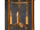 a large brass lantern hanging from the ceiling