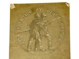 une plaque en bronze sur laquelle figurent les portraits d'un homme et d'une femme