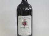 a bottle of wine that is sitting on a table