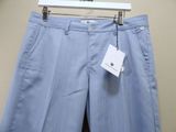the pants are blue and white striped with a tag on it