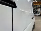 a white van that is parked in a garage