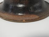 a brown hat sitting on top of a white table