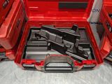 a red tool box with tools in it on a table