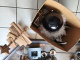 a cardboard box with a black object inside of it