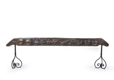 wrought iron bench with ornate scroll design on legs